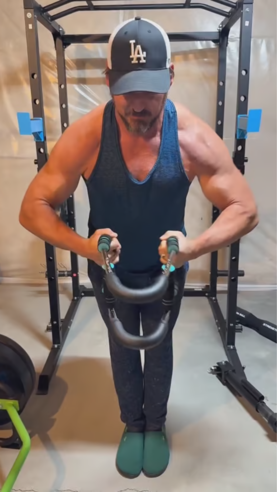Customer training with the Zixomo Gorilla Bar in a home power rack